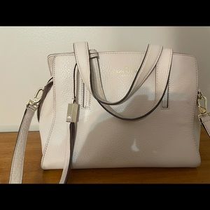 Kate Spade purse. Cream color. Pebble leather. Small ink stain on interior.